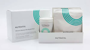 NUTRAFOL hair care products including a box, bottle, and packets on a white background