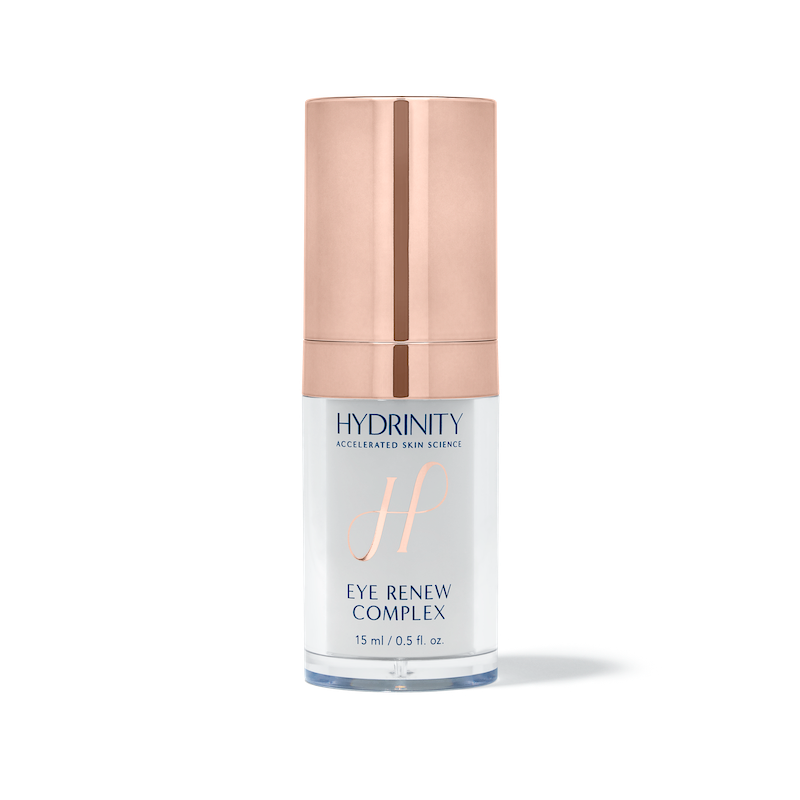 A pump bottle of Hydrinity Eye Renew Complex with a rose gold cap, labeled for intense hydration with a capacity of 15 ml.